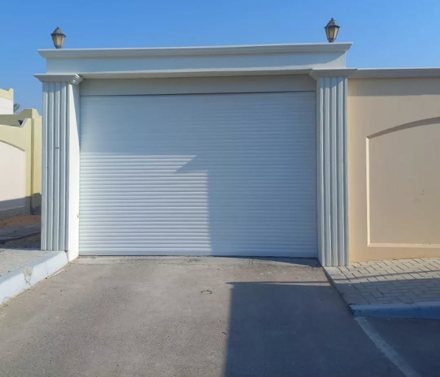 Automatic roller shutter garage door